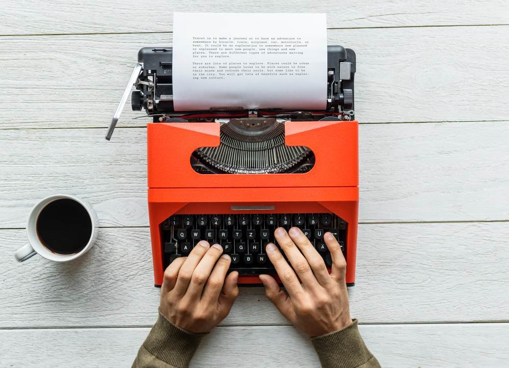 aerial view man typing retro typewriter