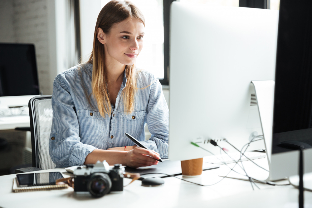 cheerful young woman work office using computer