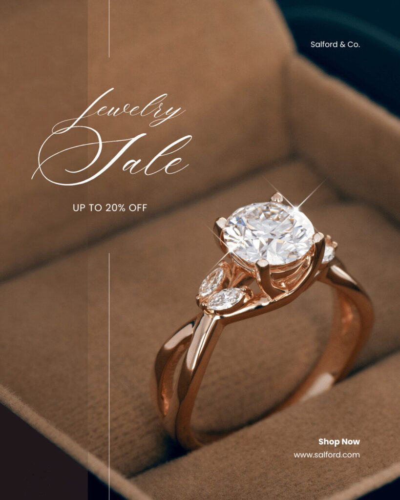 Close-up of a gold engagement ring with a large round diamond and two smaller side stones, inside a jewelry box. Text reads "Jewelry Sale, Up to 20% Off, Ecommerce Deals, Shop Now, www.salford.com".