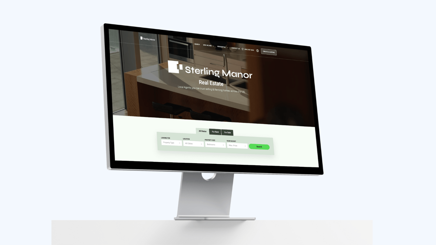 A desktop computer displaying a real estate website called Sterling Manor, showcasing web design excellence.